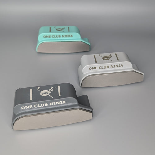 Three One Club Ninja putter attachment colors arranged together on a gray background