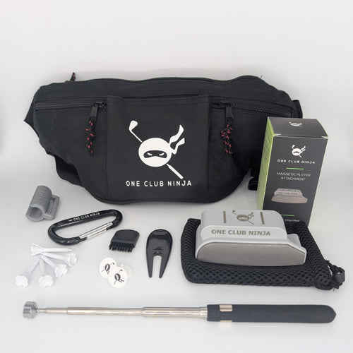 The One Club Kit flat lay with the Light Gray putter attachment, waist bag, telescoping alignment stick, and accessories